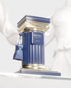 Blue and gold decorative column with 'Historic Olmeda' branding on a white background