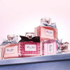 Collection of Dior perfume bottles with ribbons on a white background