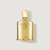 Gold Creed perfume bottle on a light gray background