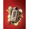 Perfume bottle labeled '9' with pineapple and citrus fruits on a red background