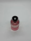 Pink bottle with black cap on a light gray background
