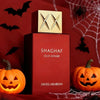 Swiss Arabian Shaghaf Oud Ahmar perfume bottle and box set, styled with Halloween props including jack-o'-lanterns, spiderwebs, and black bats on a red background.