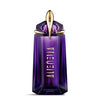 Thierry Mugler Alien perfume box held by a hand on a blurred background