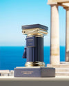 Trophie de l'Excellence award with classical design against a scenic background