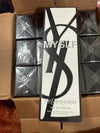 Yves Saint Laurent perfume box with 'MYSLF' branding on a cardboard surface